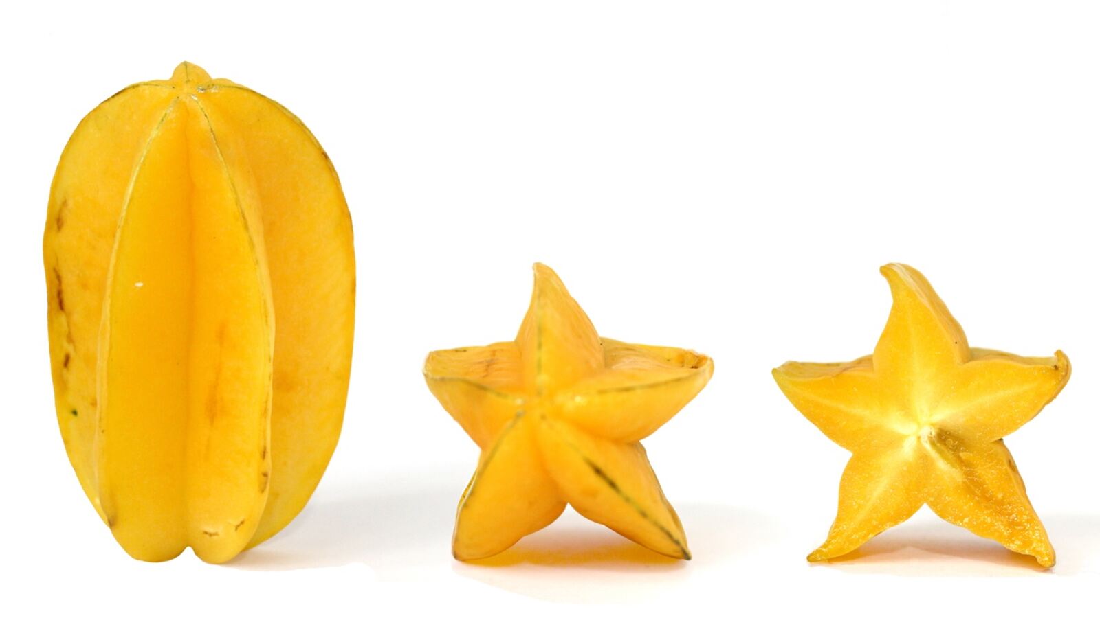 Star fruit whole and sliced to show the five-pointed star cross-section
